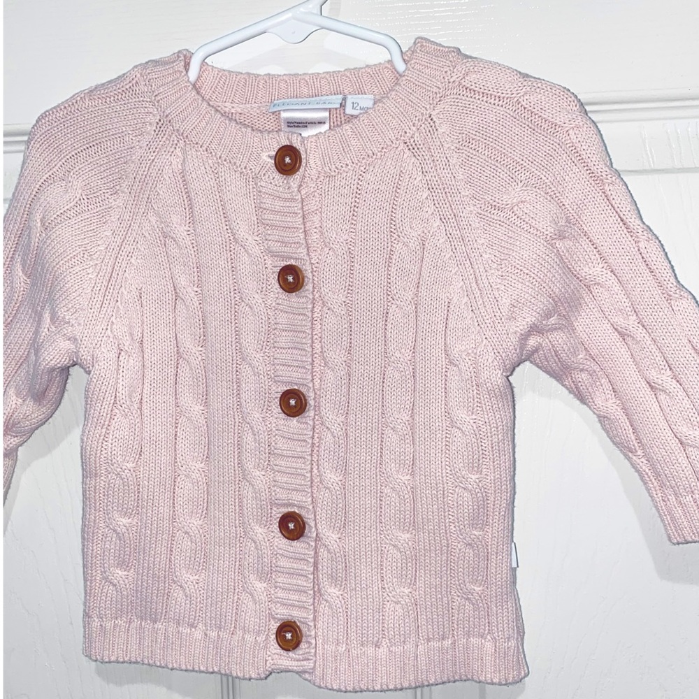 Elegant Baby pink button down cardigan sweater.